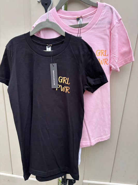 Black t-shirt with 'GRL PWR' text on a white surface